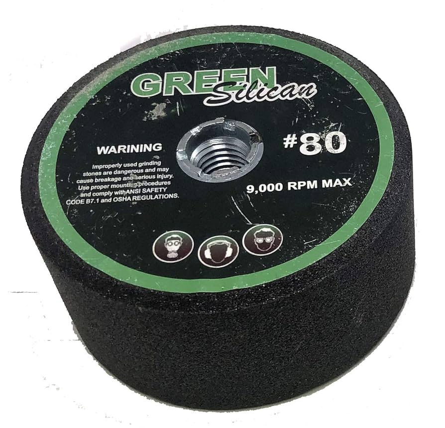A relevant stock photo of green silicon carbide grinding stones in a typical setting.