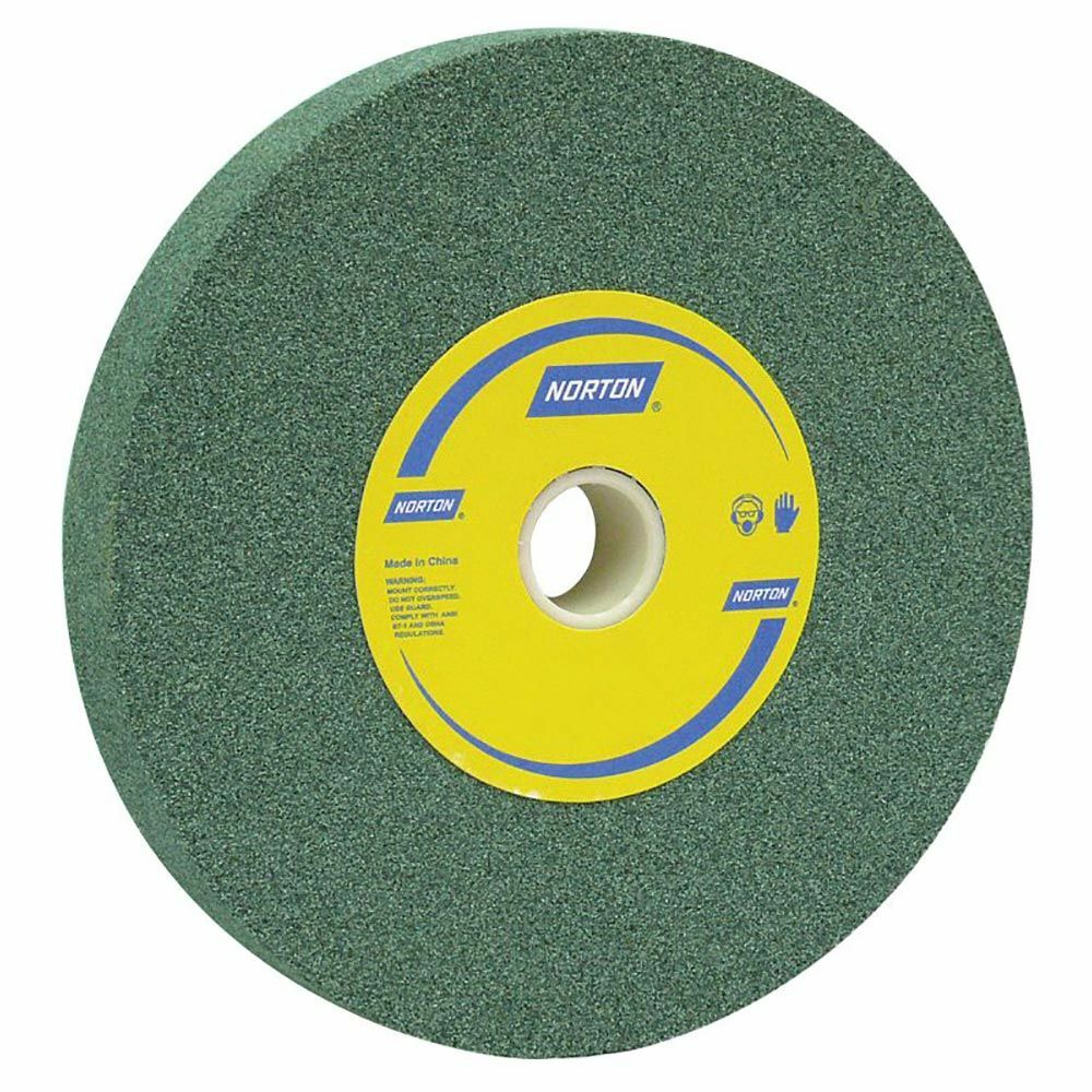 A relevant stock photo of norton green silicon carbide grinding wheel in a typical setting.
