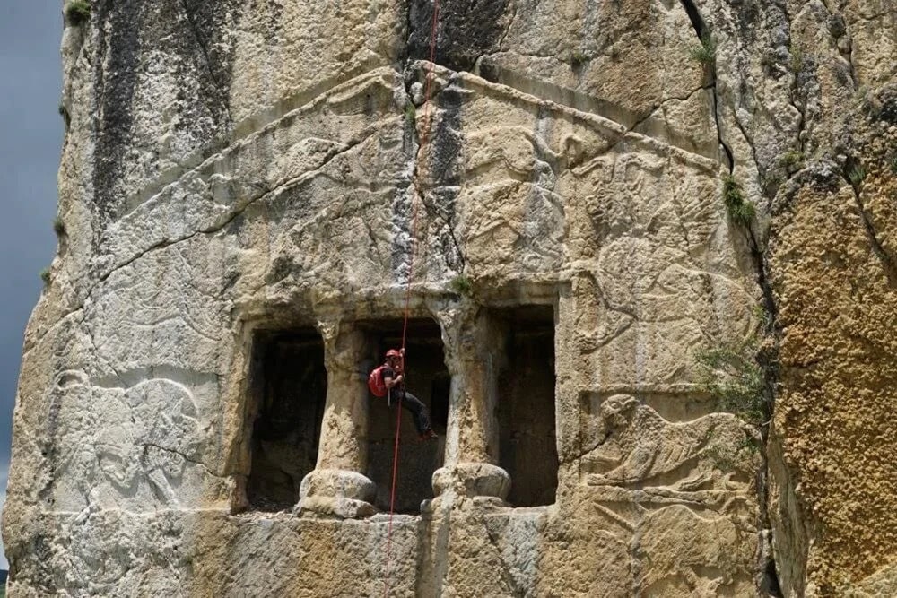 A relevant stock photo of rock tumb in a typical setting.