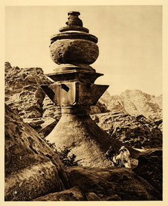 A relevant stock photo of rock tumb in a typical setting.